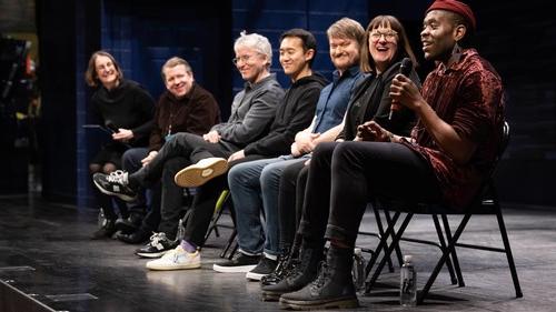 Panel speaking on a stage