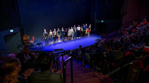 group of people on a stage 