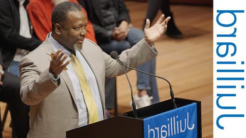 A man speaking at a podium